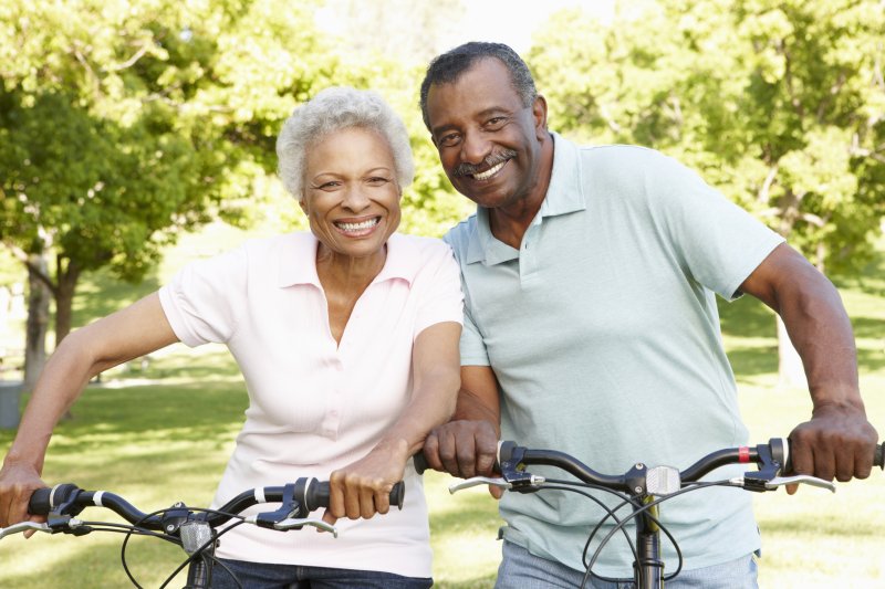 Senior couple riding bikes