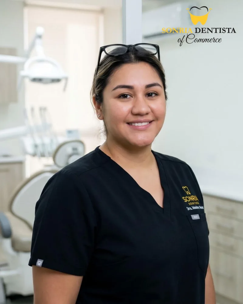 Elizabeth, Office Manager at Sonria Dentista Commerce, in a treatment room