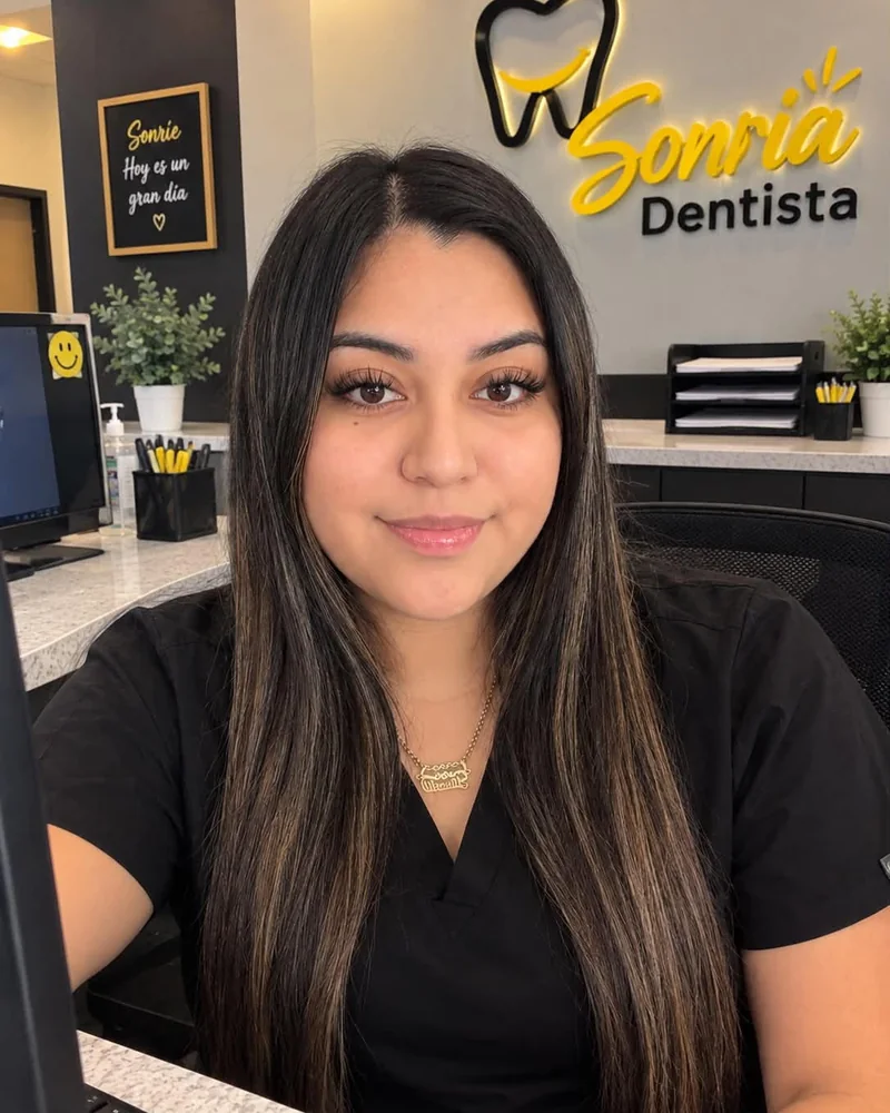 Giselle, front desk team member at Sonria Dentista Commerce, at the front desk