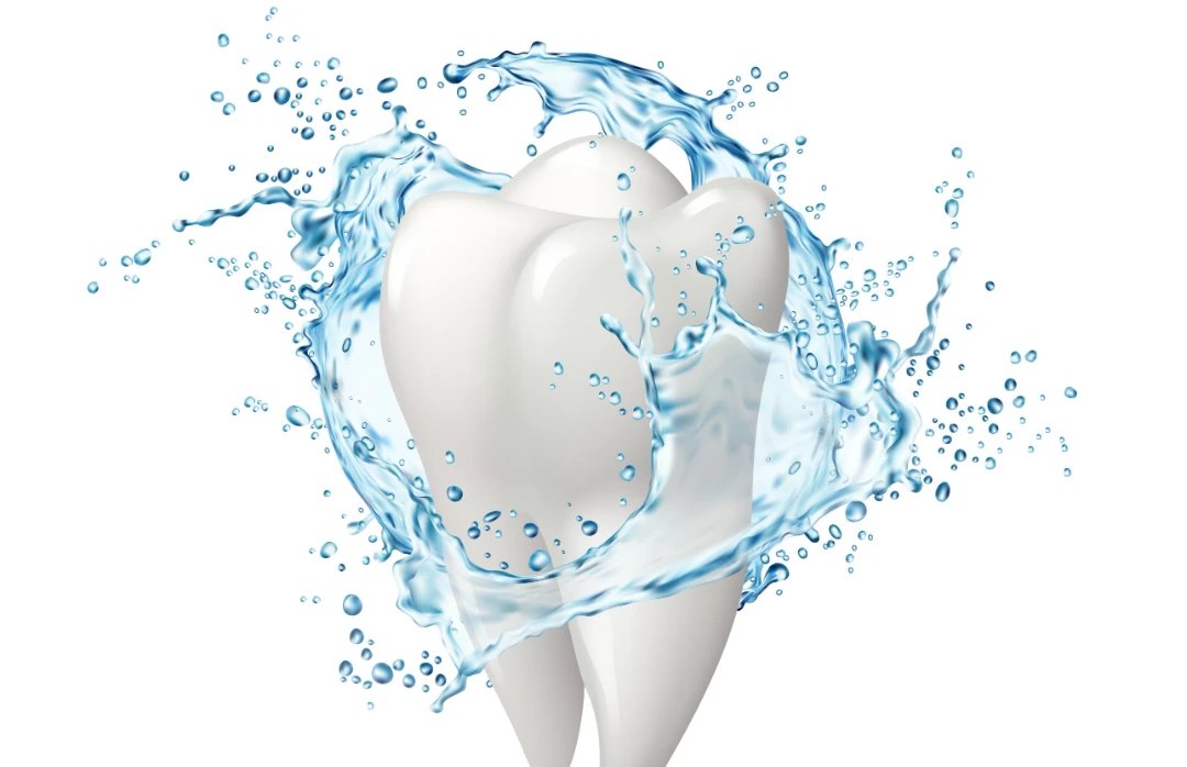 Clean white tooth surrounded by a splash of water